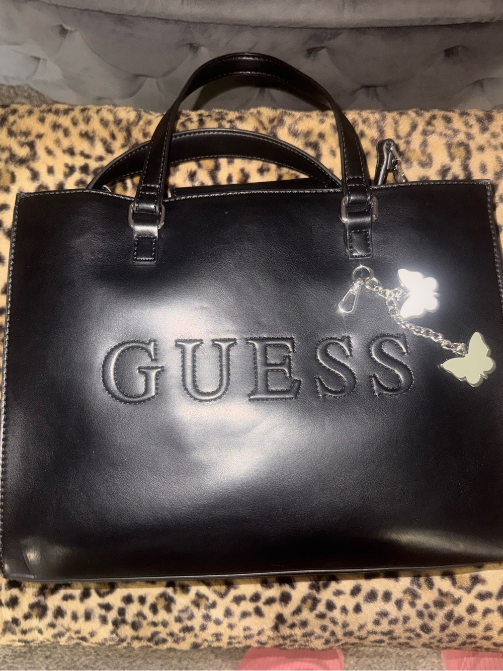 GUESS Black Satchel with Embossed Logo and Butterfly Charm